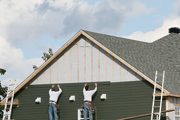 Professional Siding technician working in Boston, VA
